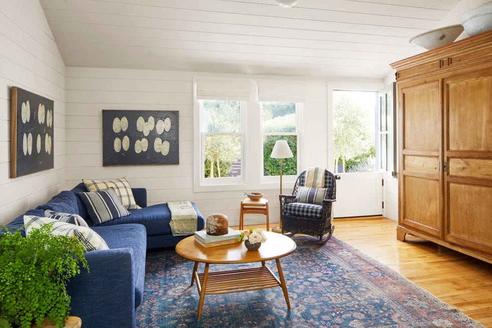 Curtis white shiplap living room white shiplap living room with blue sectional and pine armoire