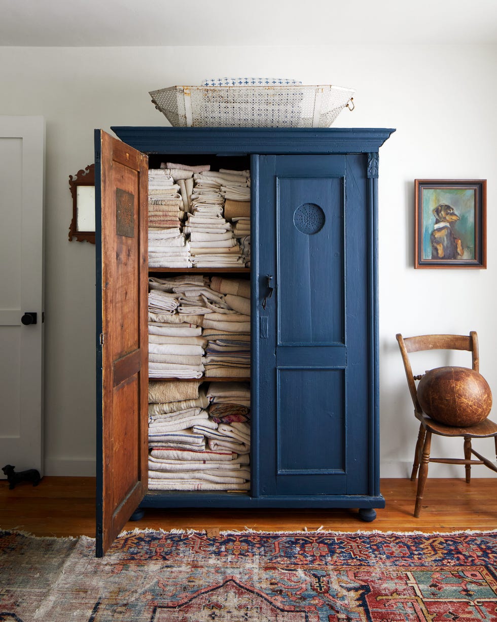 antique armoire with vintage French linens antique blue armoire stacked full with vintage french linens