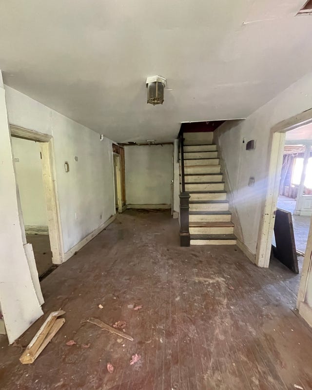 interior view of a staircase leading to an upper level in a vacant room