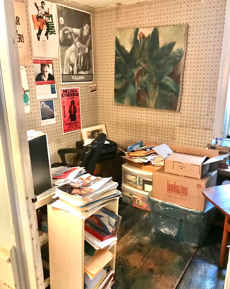 a room with boxes and posters on the wall a room with boxes and posters on the wall