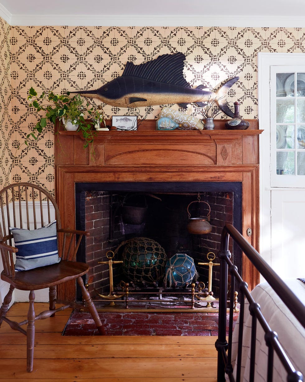 a wood mantel with a sailfish above a wood mantel with a sailfish above