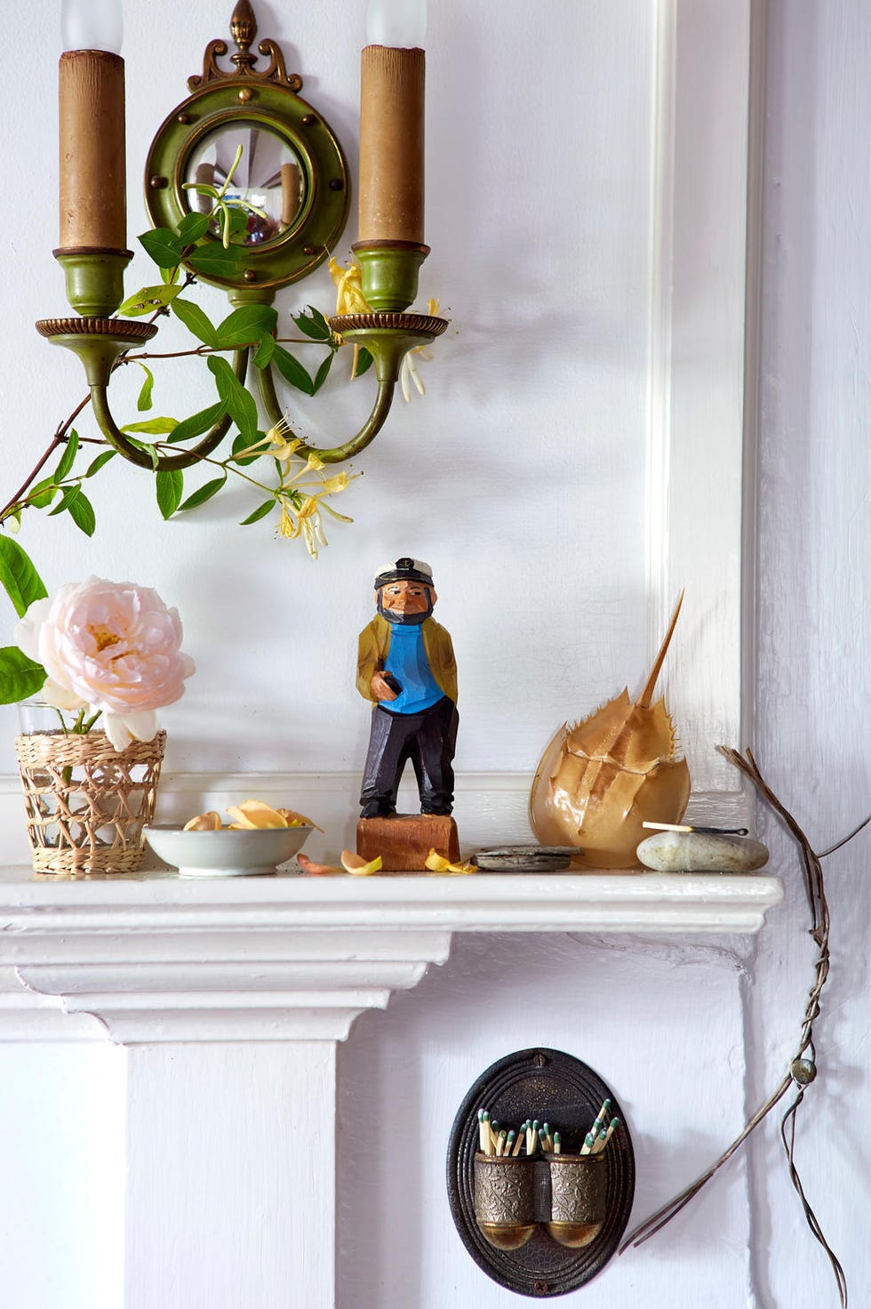 a white mantel with nautical collectibles a white mantel with nautical collectibles
