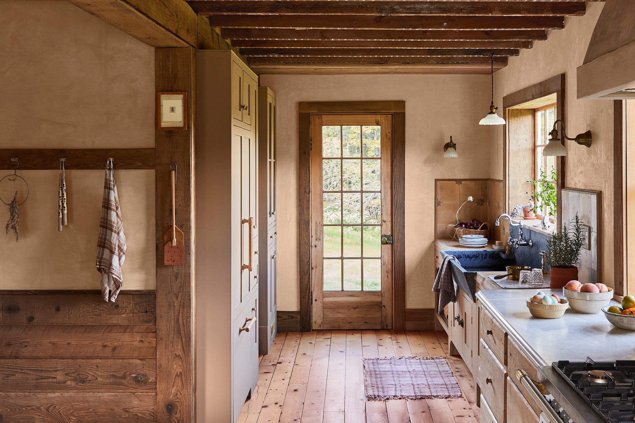 kitchen with wood floors, cabinetry, and built in pantry