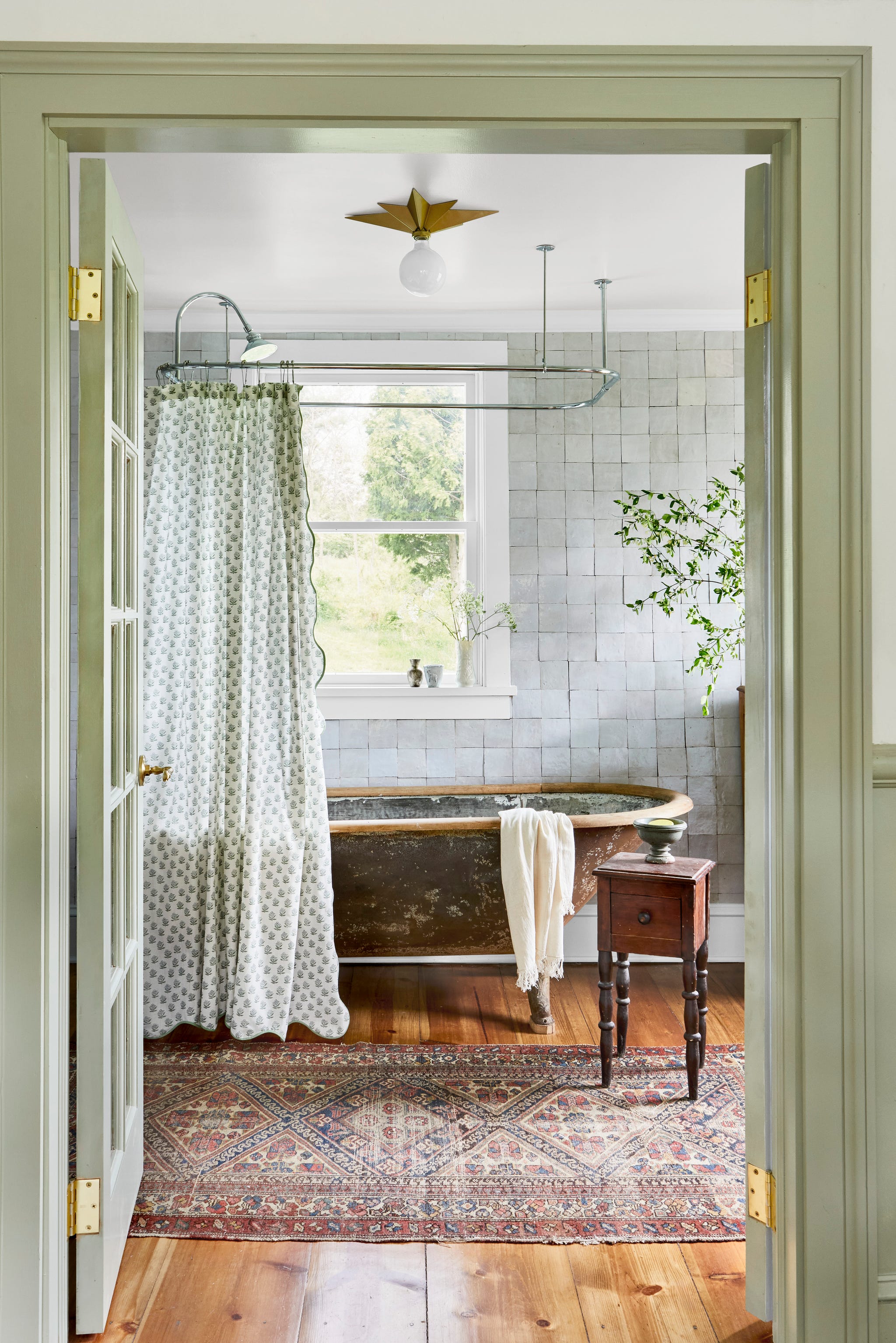 bathroom with a vintage bathtub shower curtain and wooden accents