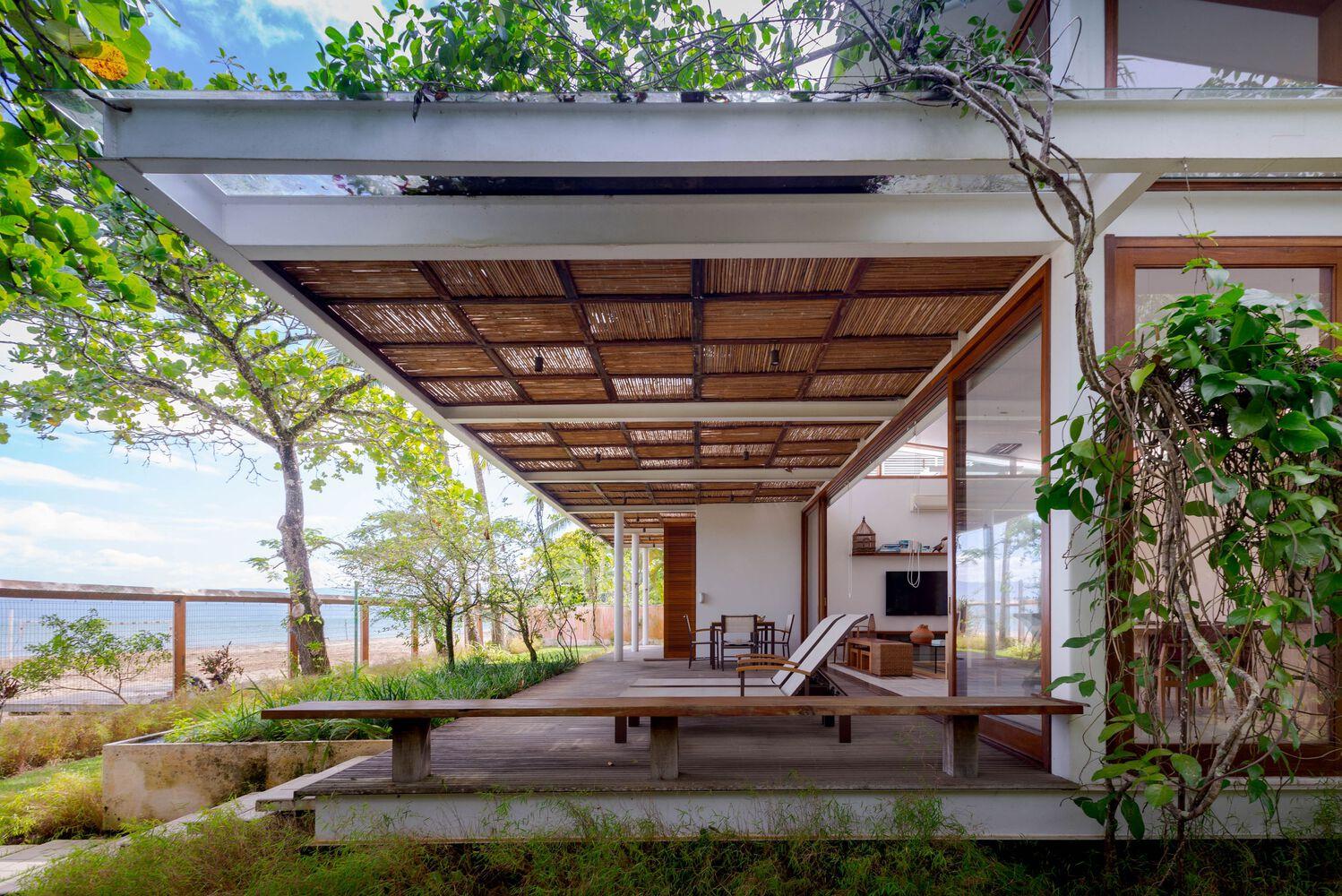 one-story house with a thatched canopy