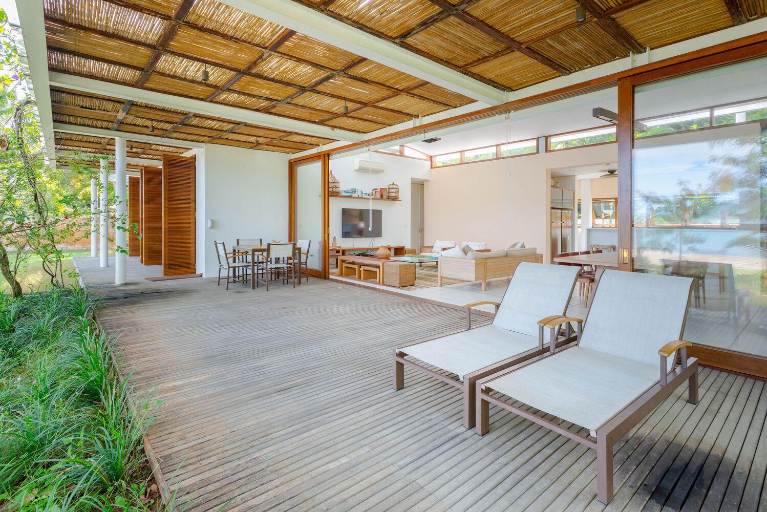 one-story house with a thatched canopy