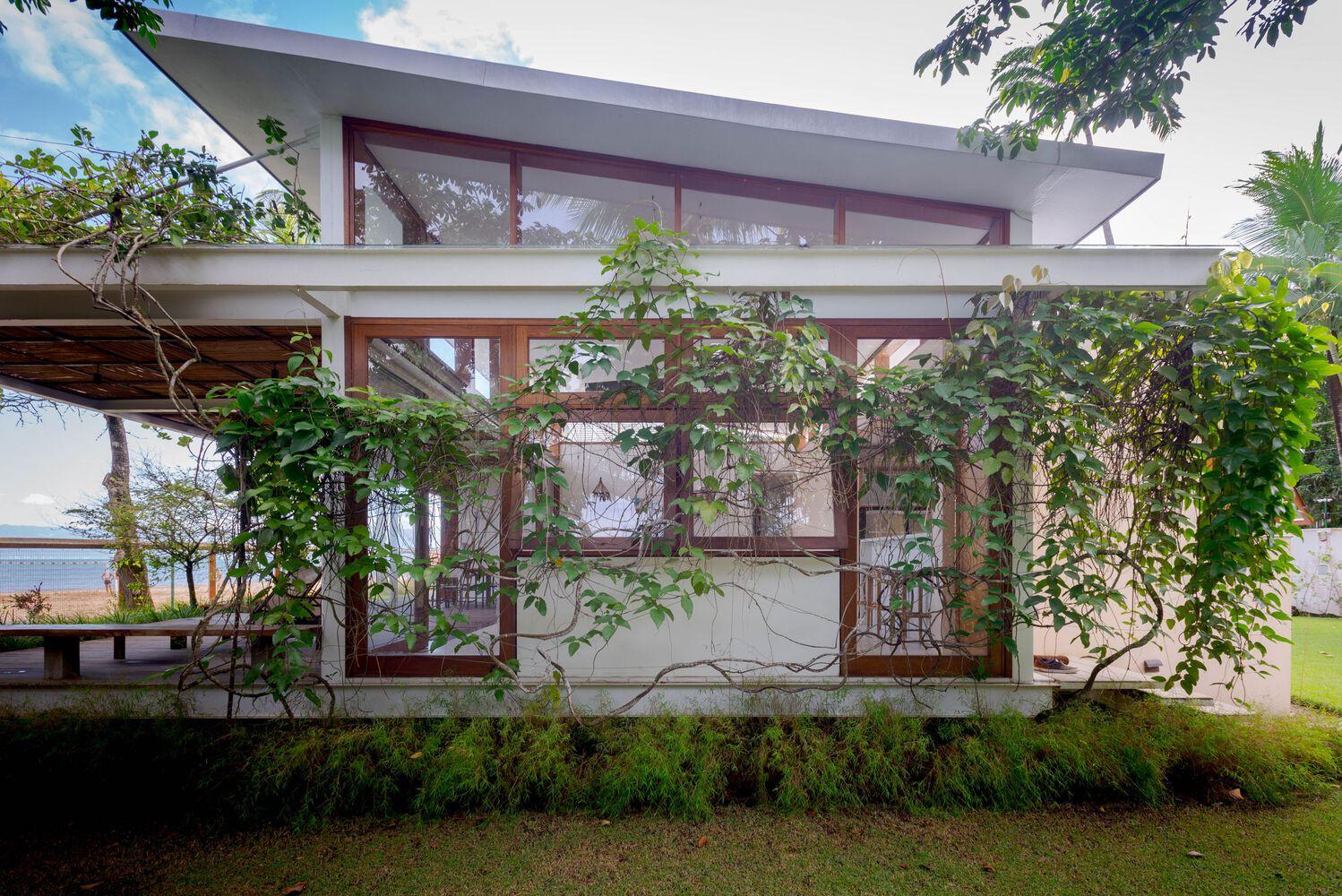 one-story house with a thatched canopy