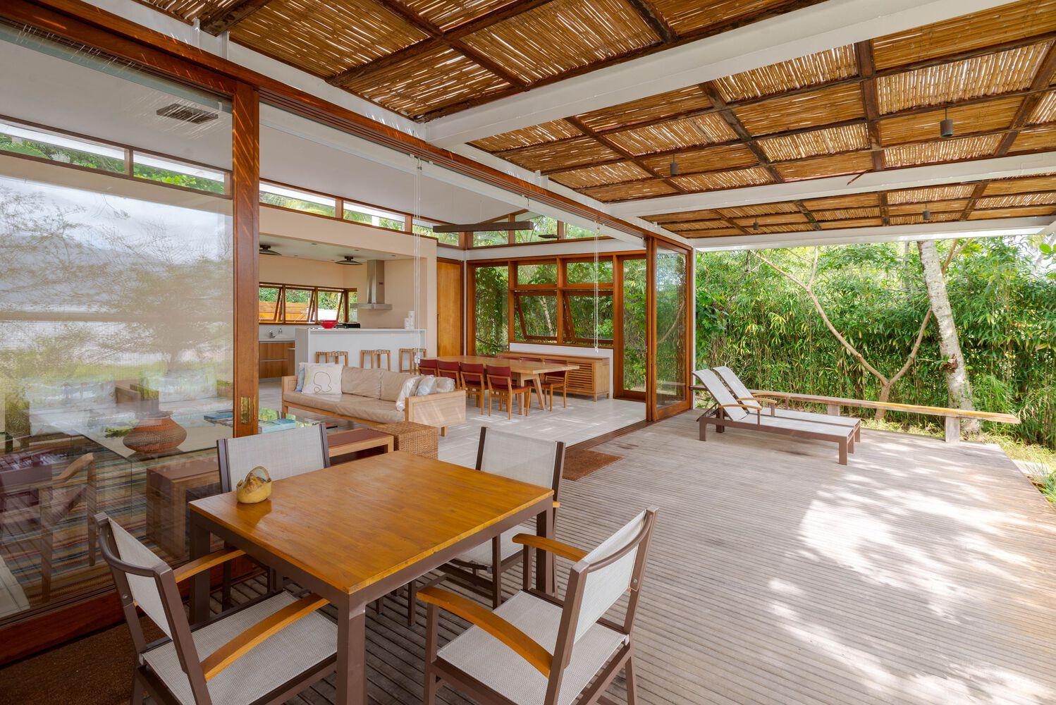 one-story house with a thatched canopy