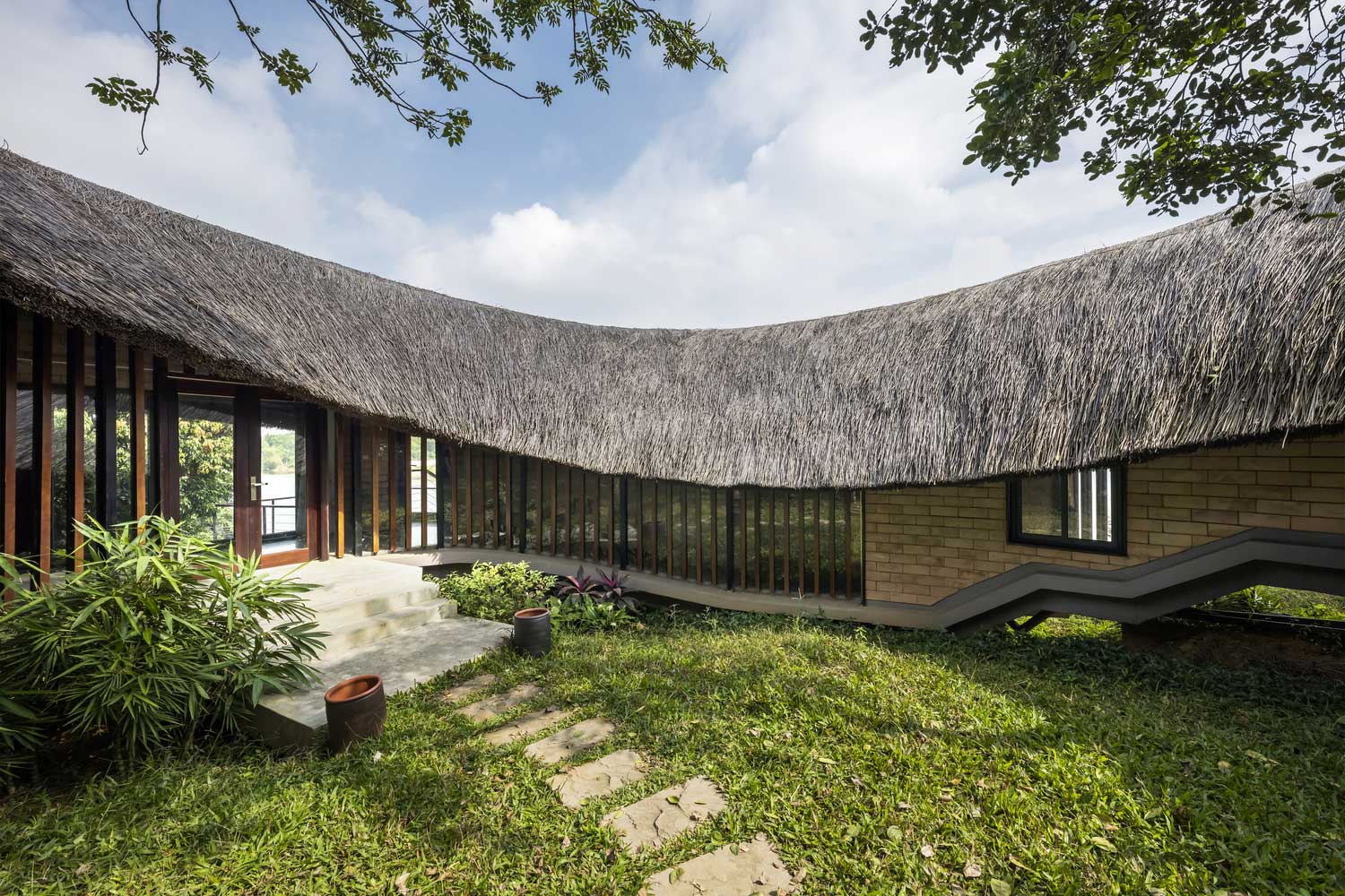 Unique Straw Roof Shape in Contemporary Bungalow