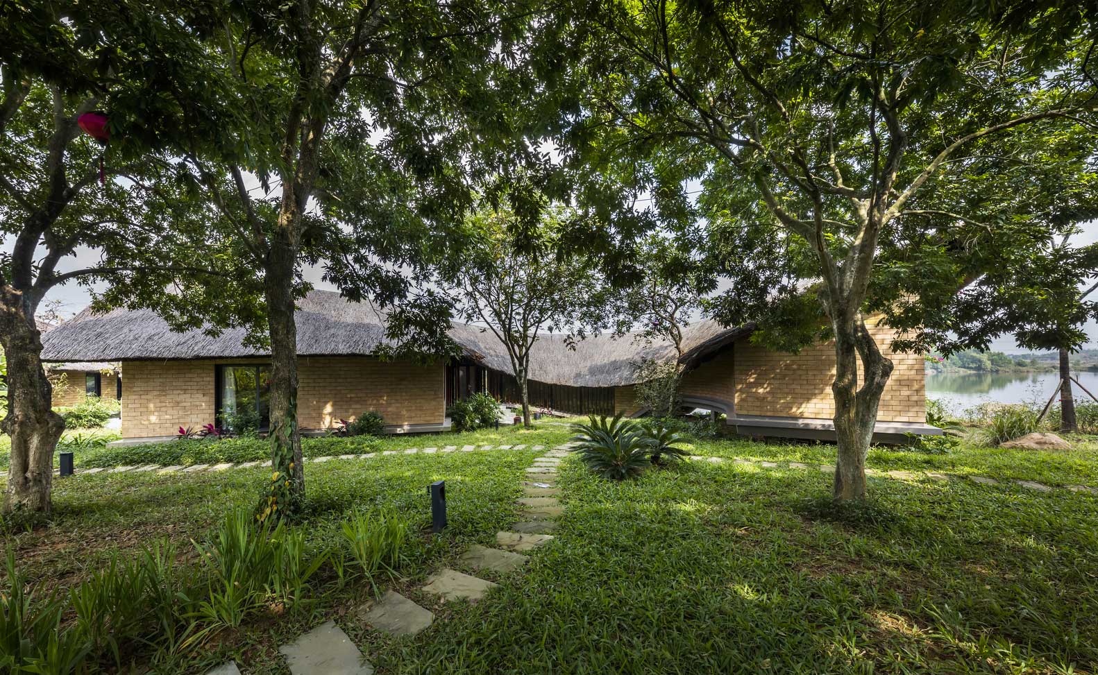 Unique Straw Roof Shape in Contemporary Bungalow