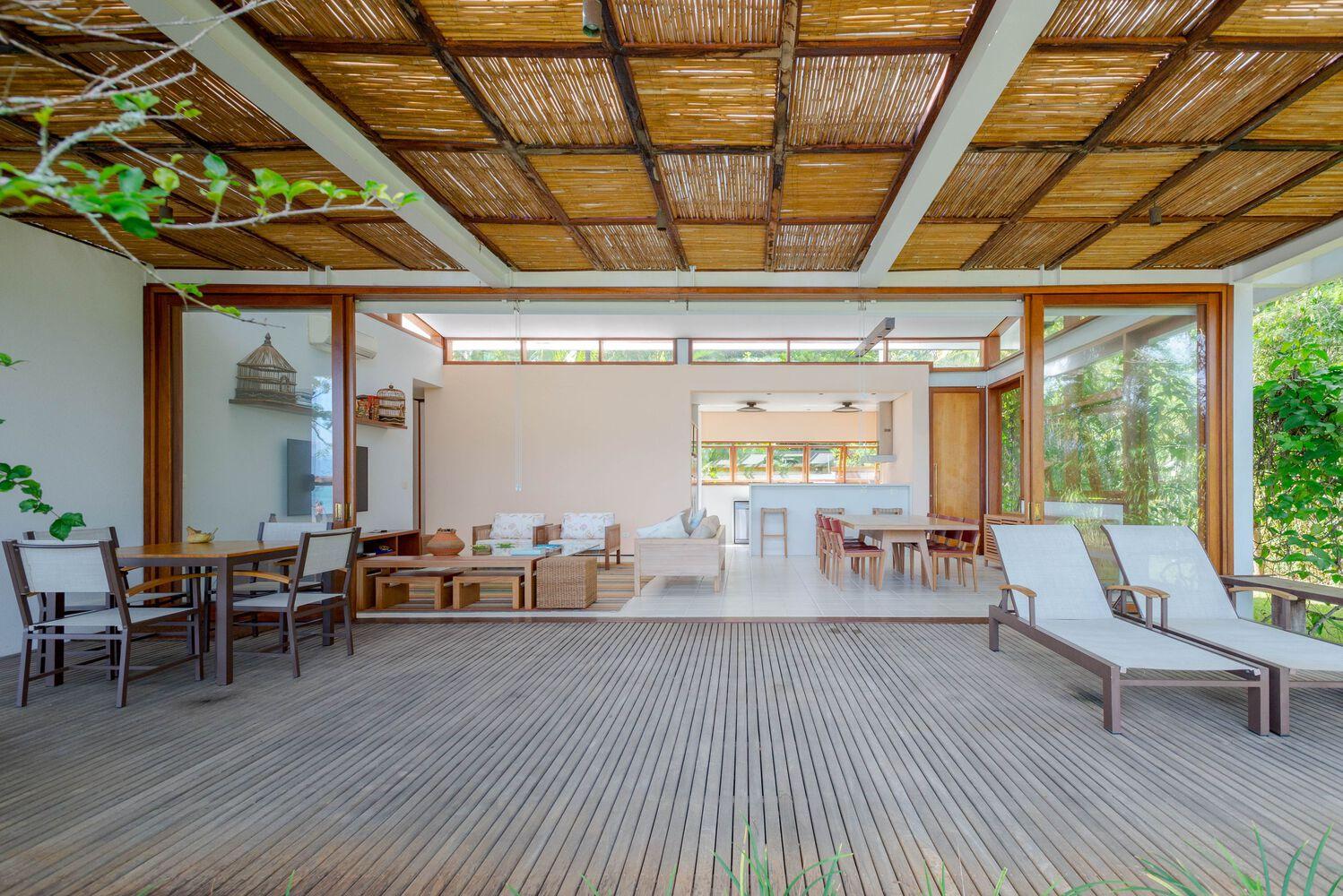 one-story house with a thatched canopy