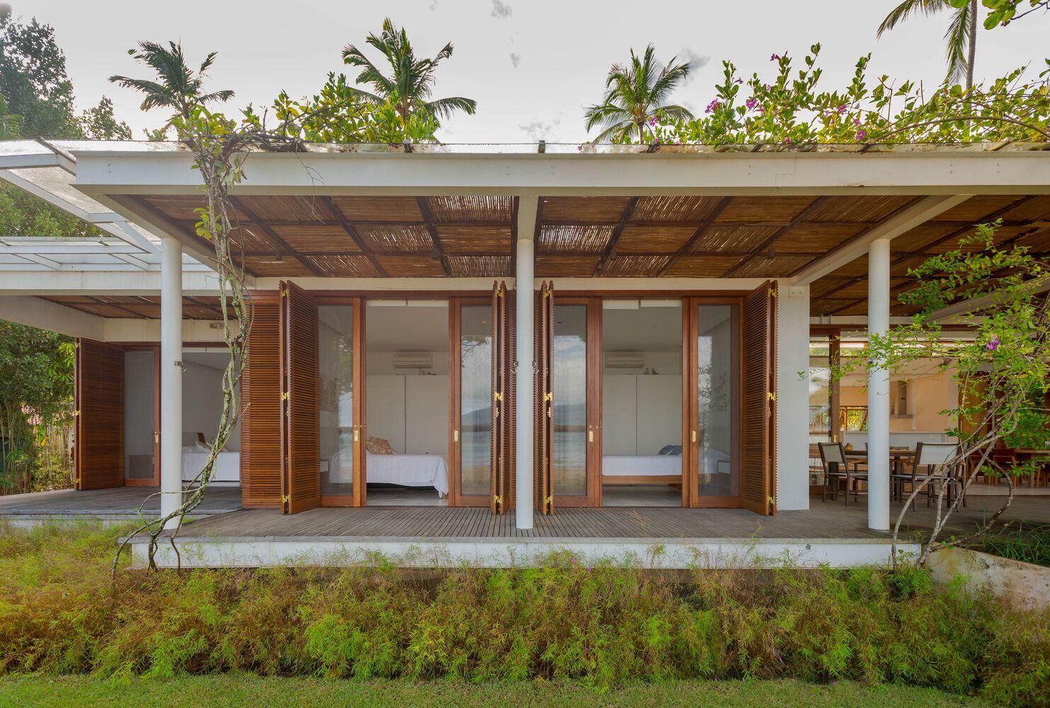 one-story house with a thatched canopy