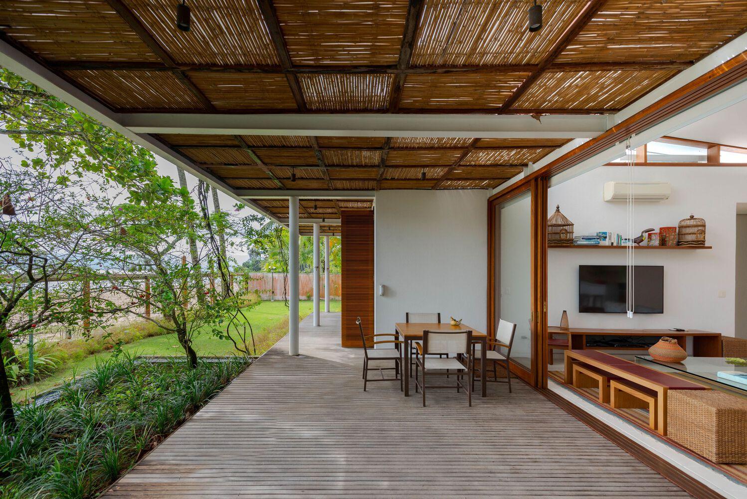 one-story house with a thatched canopy